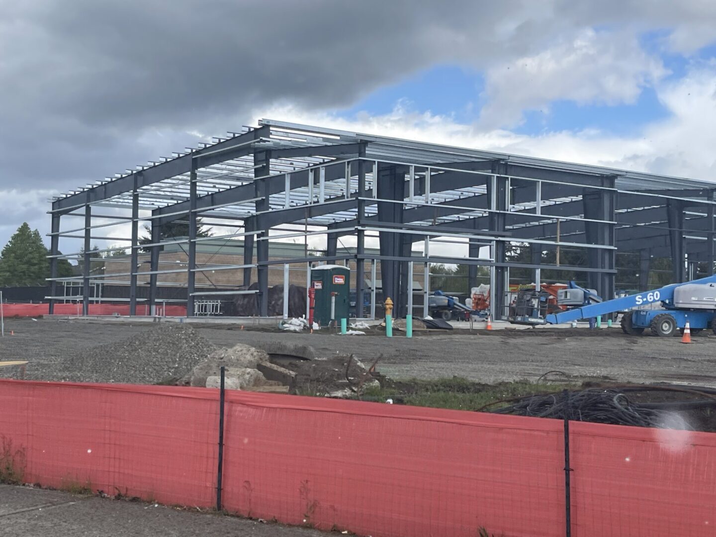 A building that is under construction with red walls.