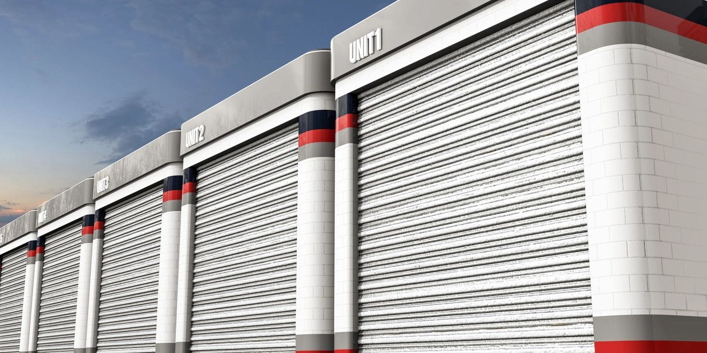 A close up of the side of a building with rolling shutters.